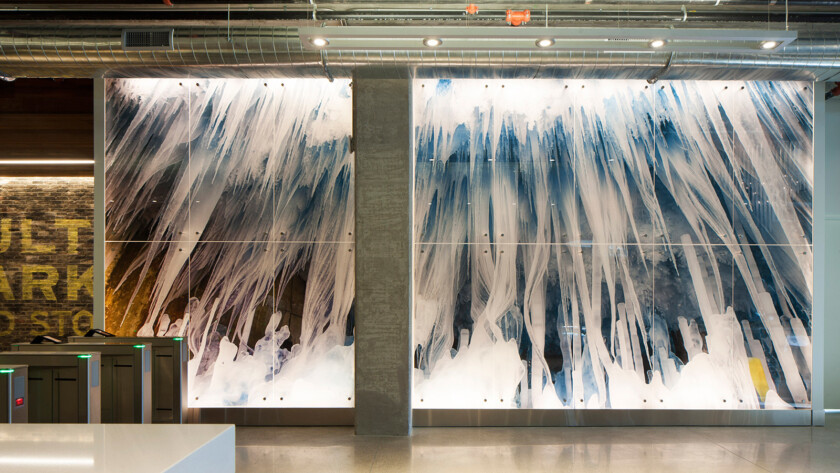 A piece of architectural glass artwork designed by Suzanne Tick, photographed by Bonnie Edelman and printed on glass on the lobby of 1k Fulton by Skyline Design architectural glass manufacturer